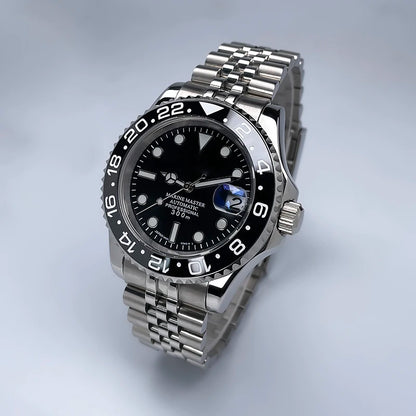 40 mm átmérőjű, YM Design kétirányban forgó keret, zafírüveg, világító számlap, NH35 szerkezethez, Jubile szíjjal ellátott luxus férfi karóra